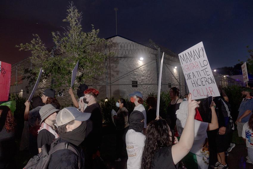People chant and wave flags during a picket line outside of the Core Civic Processing Center where Margarita Avila and others are being detained, Friday, June 13, 2025, in Houston.(Lexi Parra for The Texas Tribune)